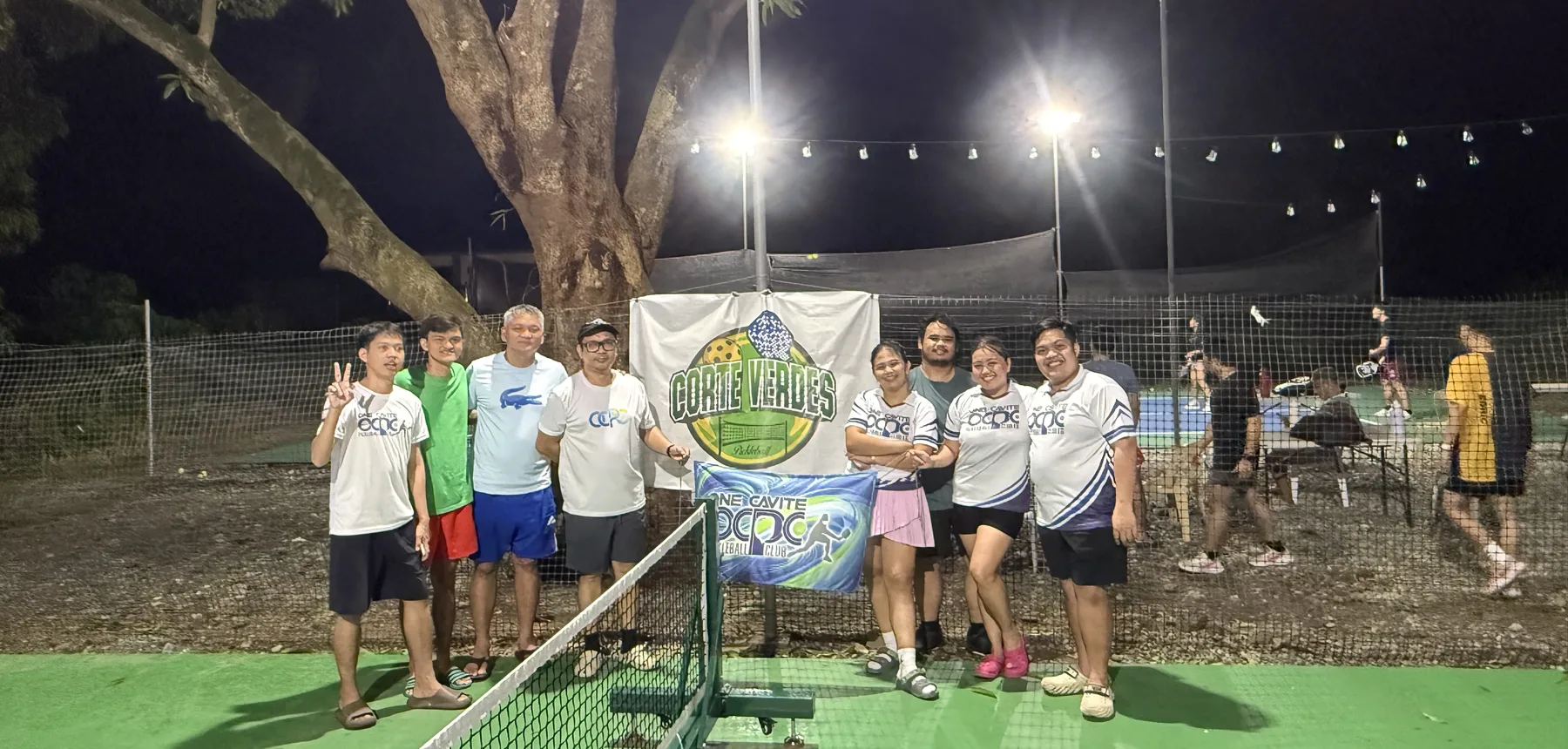 OCPC members posing with the Corte Verdes banner during a night session in San Isidro, Nueva Ecija