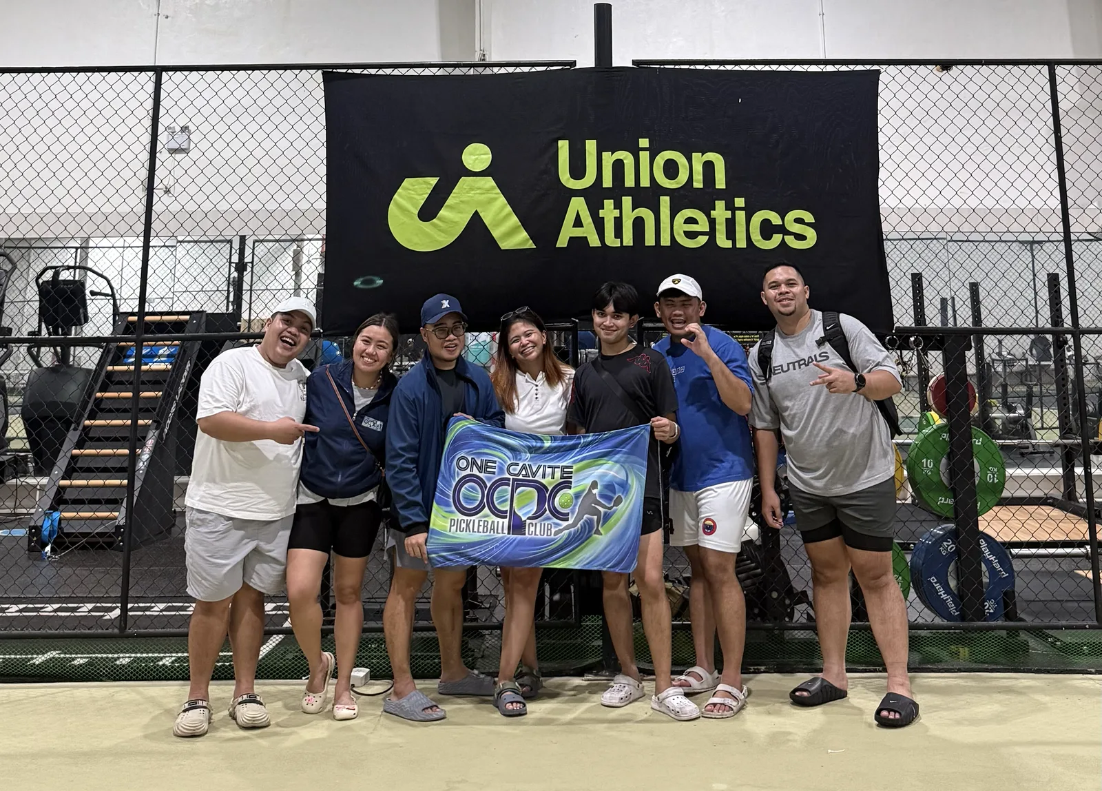 OCPC team photo with the OCPC banner at Union Athletics Sports Complex