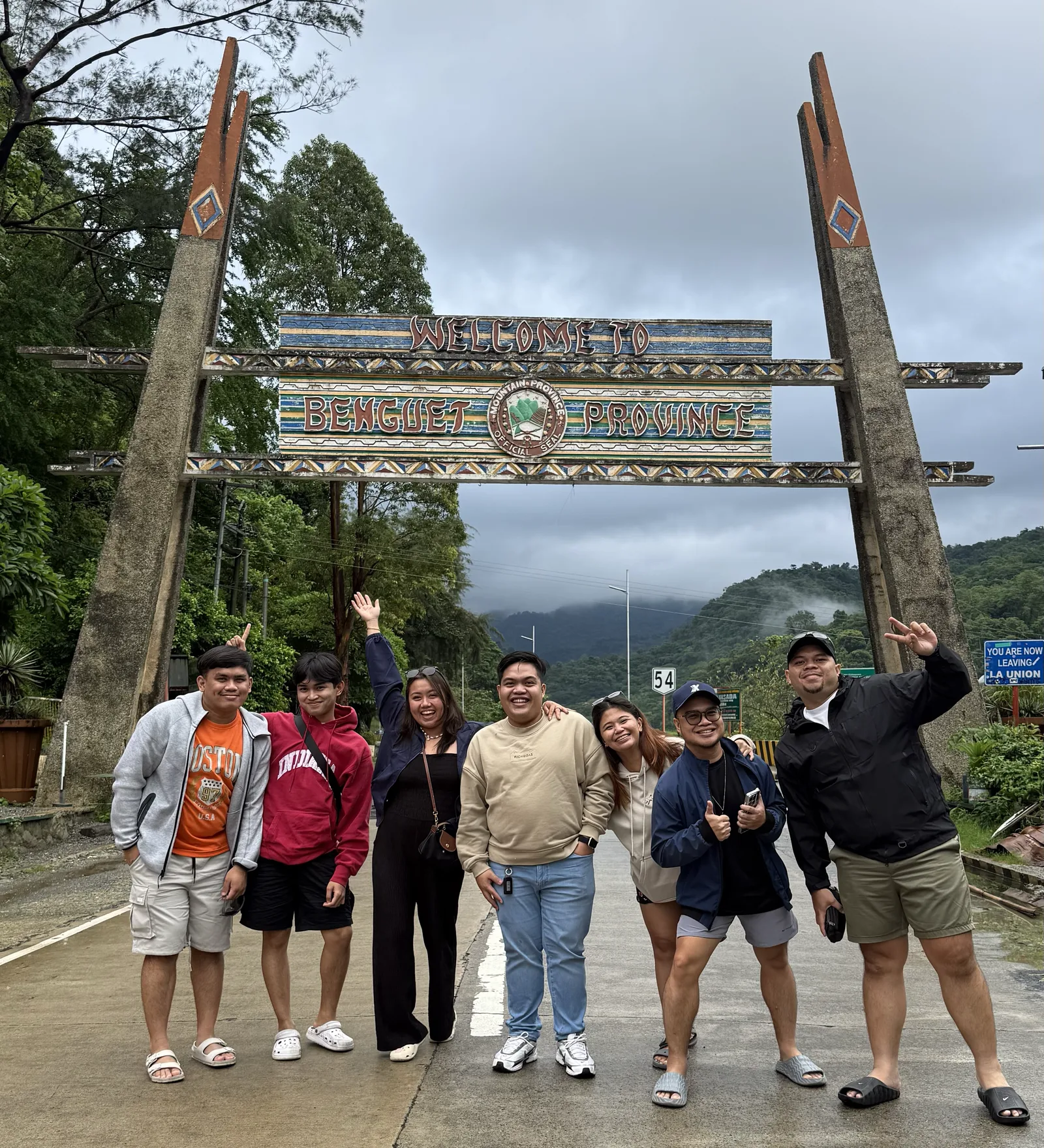 OCPC members posing at the Welcome to Benguet Province arch on the drive up